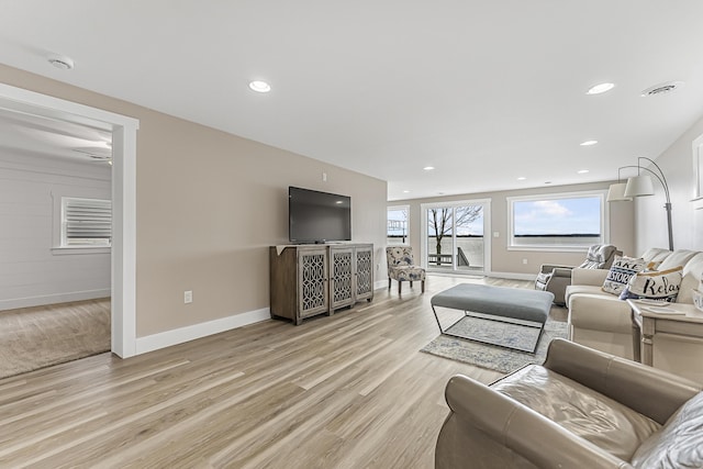 3551 W W Lake Mitchell Dr, Cadillac, MI 49601 - living room featuring baseboards, light wood finished floors, recessed lighting, and ceiling fan