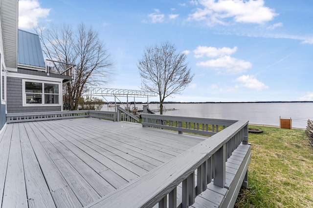 3551 W W Lake Mitchell Dr, Cadillac, MI 49601 - wooden terrace featuring a water view and a lawn