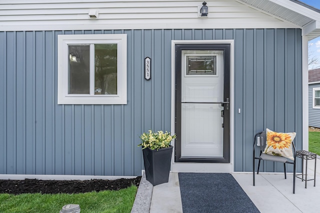 3551 W W Lake Mitchell Dr, Cadillac, MI 49601 - property entrance with board and batten siding