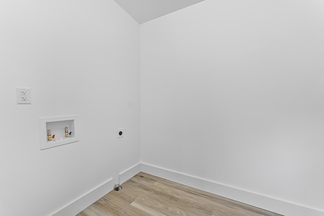 3551 W W Lake Mitchell Dr, Cadillac, MI 49601 - washroom with hookup for an electric dryer, washer hookup, light wood-type flooring, and baseboards