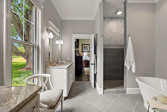 2582 3 Mile Rd NE, Grand Rapids, MI 49525 - bathroom with tiled shower, vanity, a freestanding tub, ornamental molding, and tile patterned floors