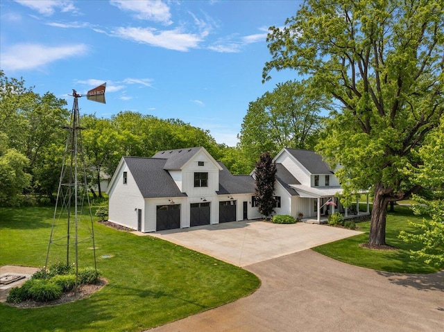 2582 3 Mile Rd NE, Grand Rapids, MI 49525 - modern farmhouse featuring driveway, a front lawn, a garage, board and batten siding, and view of wooded area