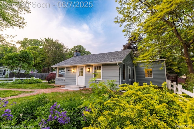 50824 Baltimore St, New Baltimore, MI 48047 - view of front facade featuring a chimney and roof with shingles