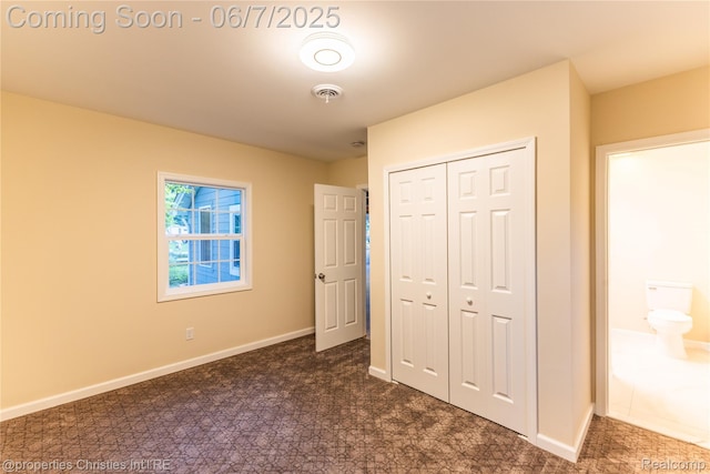 50824 Baltimore St, New Baltimore, MI 48047 - unfurnished bedroom featuring a closet, baseboards, and dark carpet