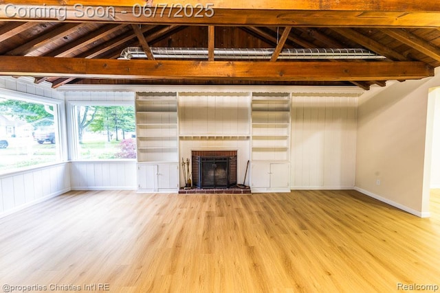 50824 Baltimore St, New Baltimore, MI 48047 - unfurnished living room with wood finished floors, a brick fireplace, and baseboards