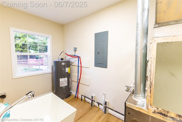 50824 Baltimore St, New Baltimore, MI 48047 - utilities featuring electric panel, water heater, and a sink
