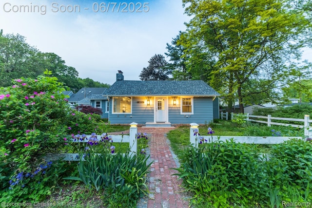 50824 Baltimore St, New Baltimore, MI 48047 - bungalow-style home with a chimney and roof with shingles