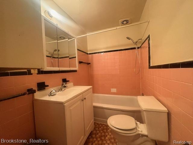 20951 Nummer St, Warren, MI 48089 - full bathroom with toilet, vanity, bathtub / shower combination, and tile walls