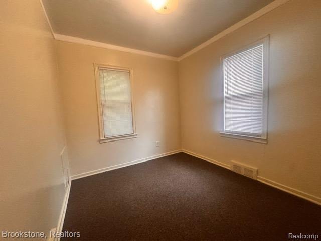 20951 Nummer St, Warren, MI 48089 - unfurnished room featuring ornamental molding, baseboards, and dark colored carpet