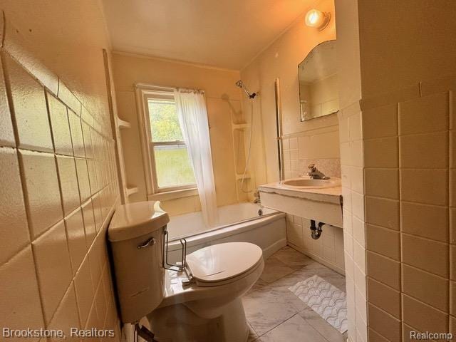 20951 Nummer St, Warren, MI 48089 - bathroom with bathtub / shower combination, marble finish flooring, a sink, toilet, and tile walls
