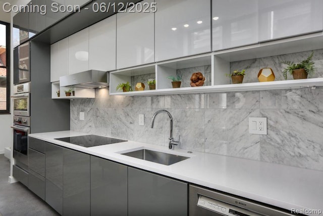 1454 Townsend St Unit 101, Detroit, MI 48214 - kitchen with open shelves, stainless steel appliances, a sink, gray cabinets, and modern cabinets