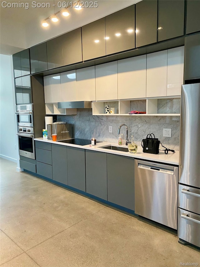 1454 Townsend St Unit 101, Detroit, MI 48214 - kitchen with stainless steel appliances, a sink, decorative backsplash, and gray cabinets