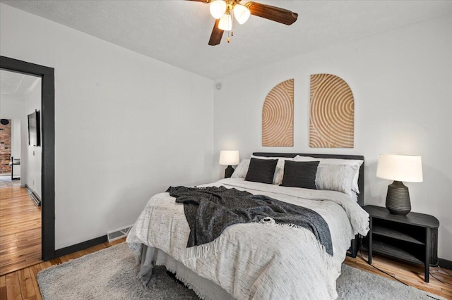 950 Crescent St NE, Grand Rapids, MI 49503 - bedroom with wood finished floors, ceiling fan, and baseboards