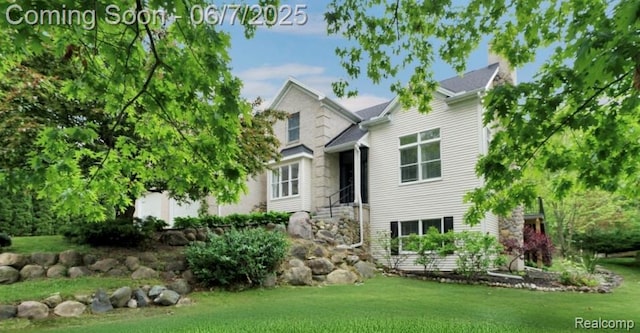 16146 Valcrest Dr, Linden, MI 48451 - view of front of house featuring a front lawn and stone siding