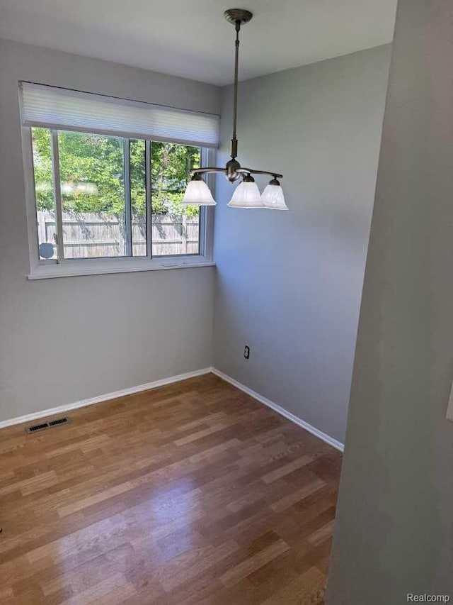 4030 W 13 Mile Rd, Lathrup Village, MI 48073 - spare room with baseboards and wood finished floors