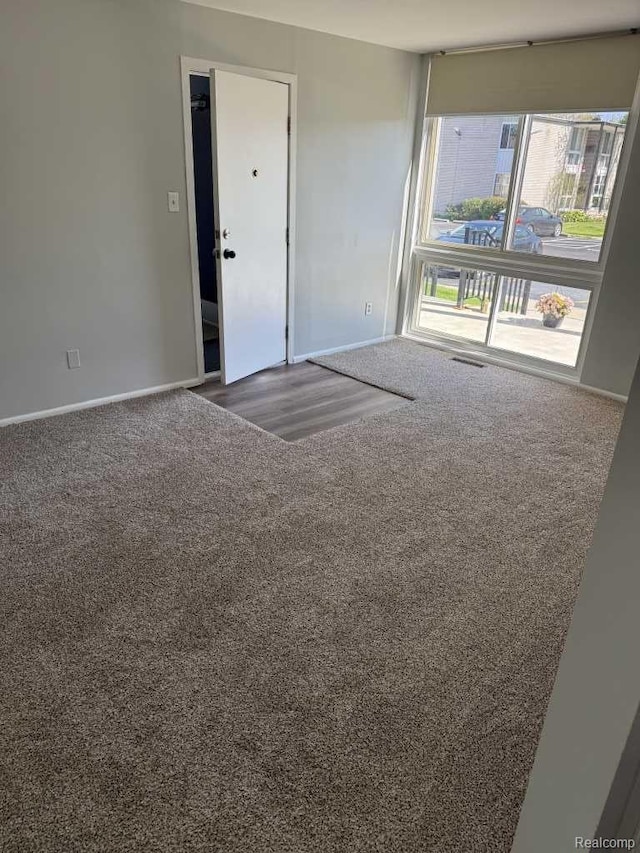 4030 W 13 Mile Rd, Lathrup Village, MI 48073 - empty room featuring carpet flooring and baseboards