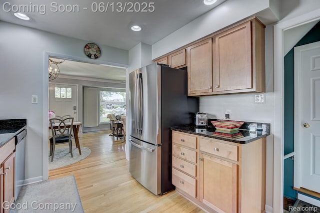 4217 Crooks Rd, Royal Oak, MI 48073 - kitchen featuring stainless steel appliances, light wood finished floors, dark stone counters, recessed lighting, and a chandelier