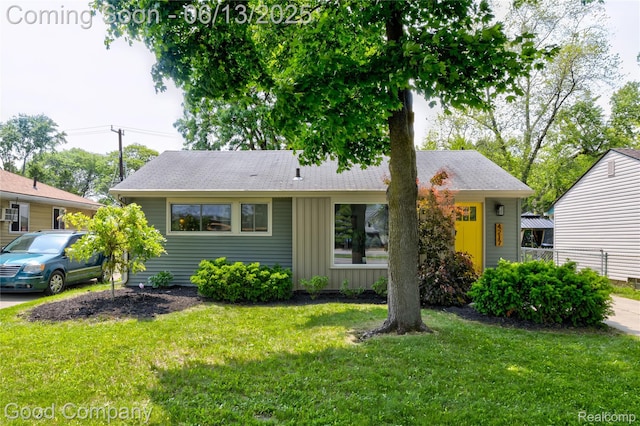 4217 Crooks Rd, Royal Oak, MI 48073 - view of front of property with board and batten siding and a front lawn