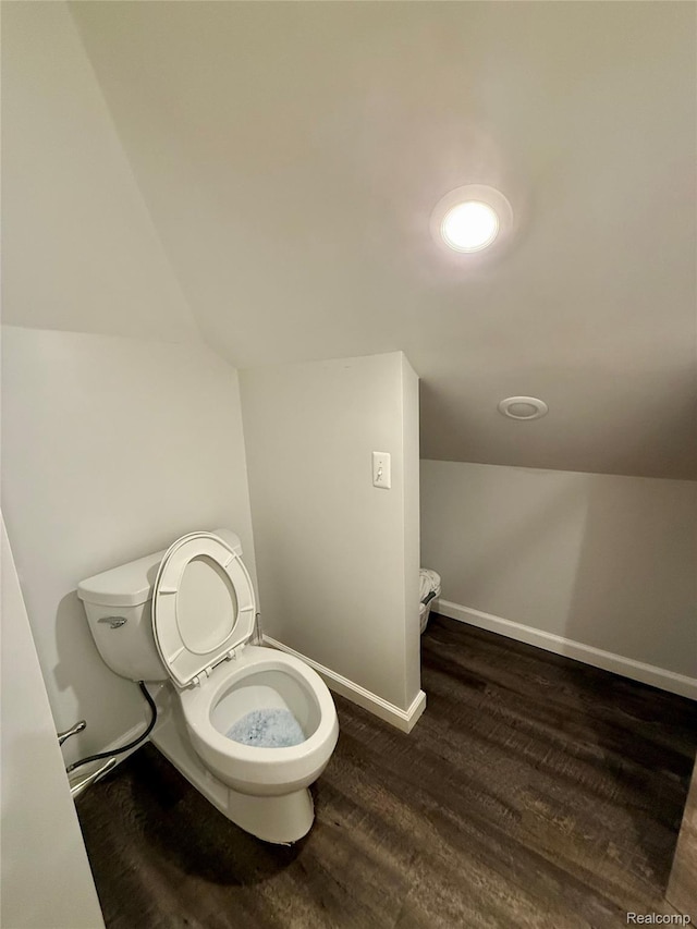 18 Park St, Oxford, MI 48371 - bathroom featuring lofted ceiling and wood finished floors