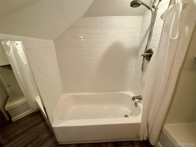 18 Park St, Oxford, MI 48371 - bathroom with wood finished floors, lofted ceiling, and shower / bath combo with shower curtain