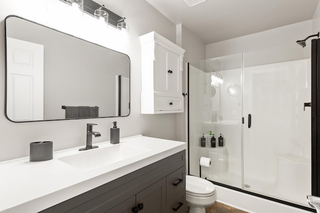 6018 Augusta Ct, Grand Blanc, MI 48439 - bathroom with a stall shower, vanity, and toilet
