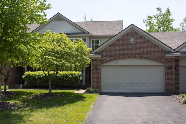 6018 Augusta Ct, Grand Blanc, MI 48439 - view of front of home with brick siding, driveway, a shingled roof, and a garage