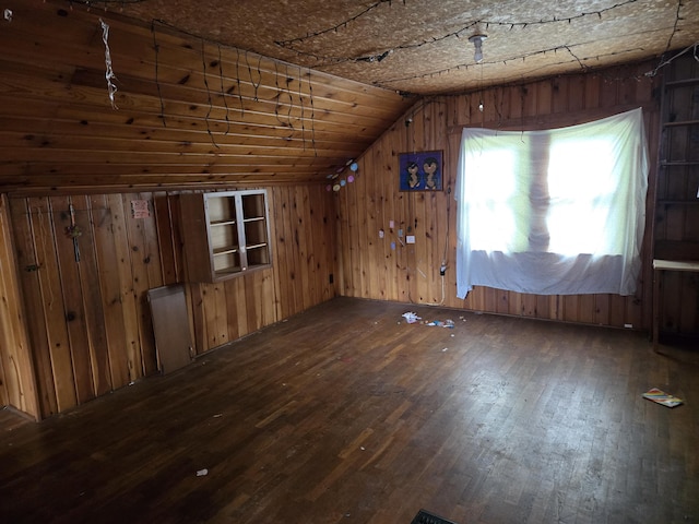 804 17th St, Jackson, MI 49203 - additional living space with hardwood / wood-style floors, lofted ceiling, and wooden walls