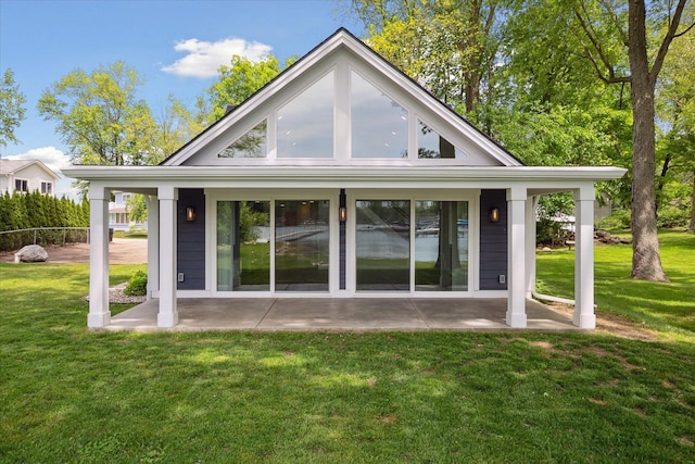 5150 Redding Dr, Pinckney, MI 48169 - rear view of property featuring a lawn and a patio