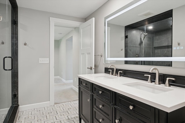 5150 Redding Dr, Pinckney, MI 48169 - bathroom featuring baseboards, a stall shower, and double vanity