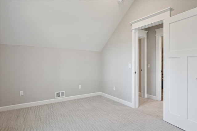 5150 Redding Dr, Pinckney, MI 48169 - bonus room with vaulted ceiling, light carpet, and baseboards