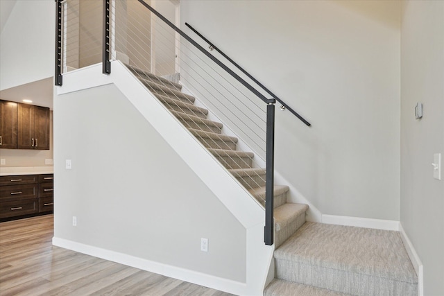 5150 Redding Dr, Pinckney, MI 48169 - staircase with wood finished floors and baseboards