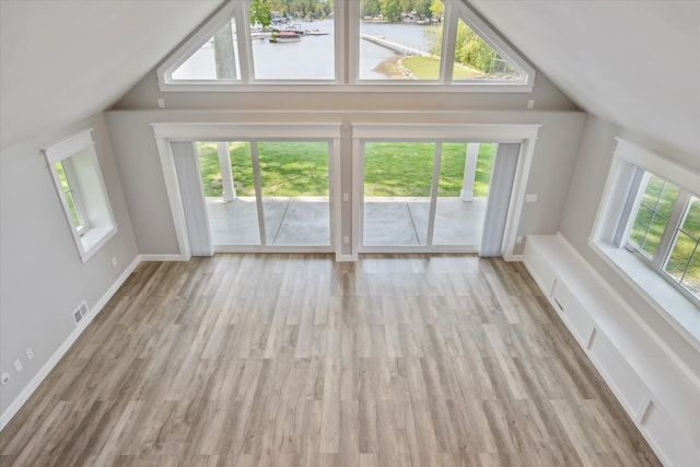 5150 Redding Dr, Pinckney, MI 48169 - bonus room featuring vaulted ceiling, a water view, wood finished floors, and baseboards
