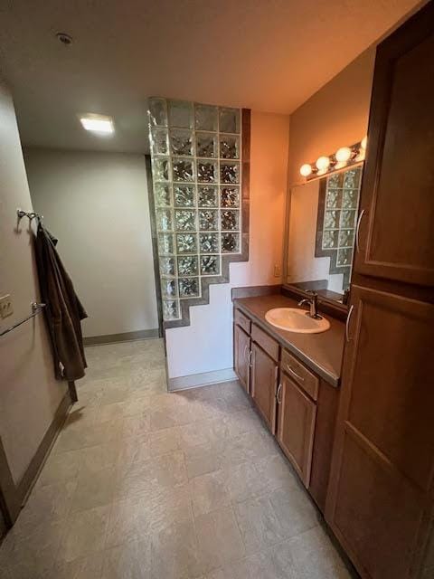 600 Albert Ave Unit 524, East Lansing, MI 48823 - bathroom featuring vanity and baseboards