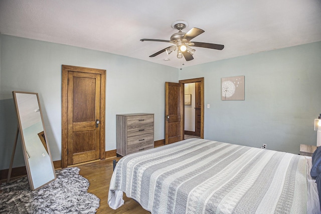 2046 Bourdon St, Muskegon, MI 49441 - bedroom featuring wood finished floors and ceiling fan