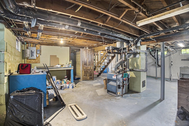 2046 Bourdon St, Muskegon, MI 49441 - unfinished below grade area with stairway, electric panel, and a heating unit