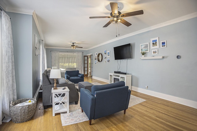 2046 Bourdon St, Muskegon, MI 49441 - living room with ceiling fan, crown molding, wood finished floors, and baseboards