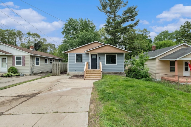 1700 Bristol Ave NW, Grand Rapids, MI 49504 - bungalow-style home featuring driveway