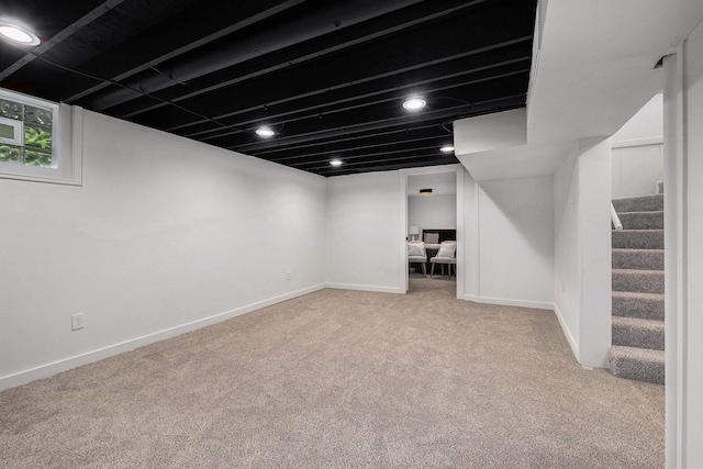 1700 Bristol Ave NW, Grand Rapids, MI 49504 - finished basement featuring carpet flooring, stairway, and baseboards