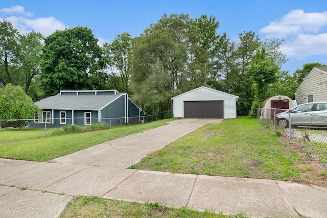 1700 Bristol Ave NW, Grand Rapids, MI 49504 - view of yard featuring an outdoor structure and a garage
