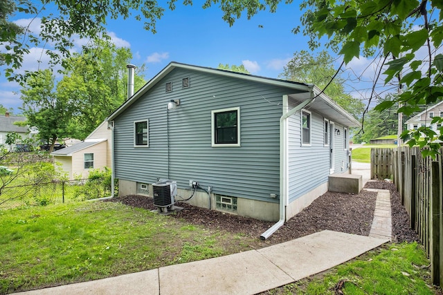 1700 Bristol Ave NW, Grand Rapids, MI 49504 - view of property exterior with central AC