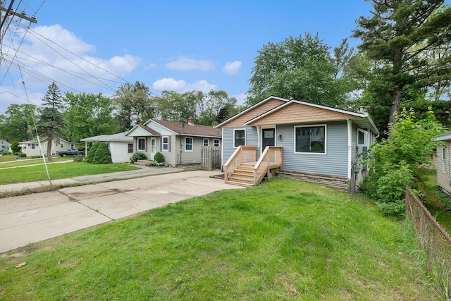 1700 Bristol Ave NW, Grand Rapids, MI 49504 - view of front of home featuring a front lawn and concrete driveway