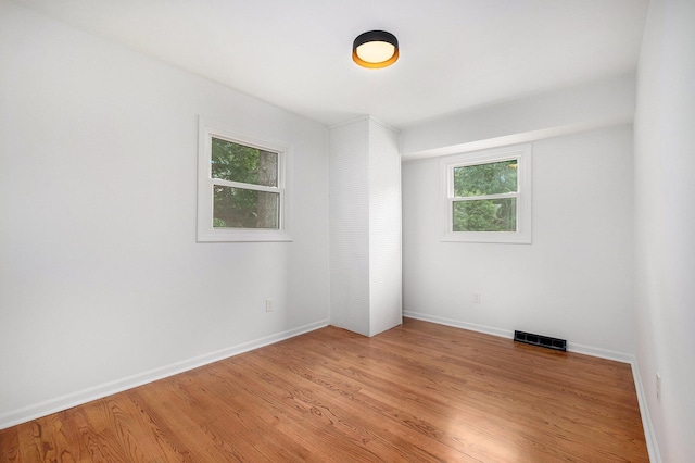 1700 Bristol Ave NW, Grand Rapids, MI 49504 - spare room featuring baseboards and light wood-style flooring