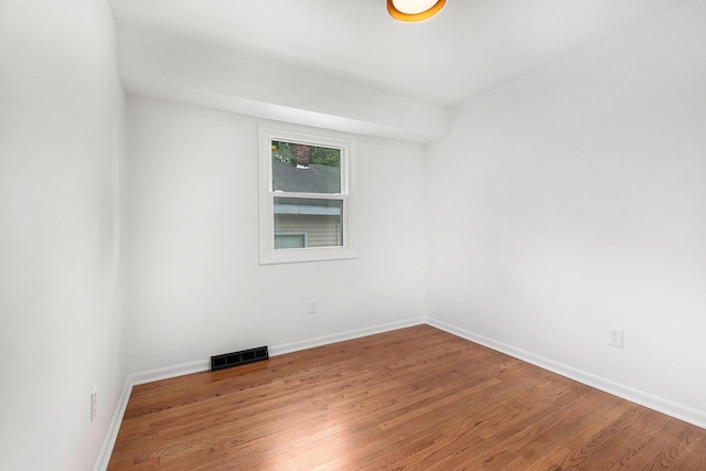 1700 Bristol Ave NW, Grand Rapids, MI 49504 - spare room featuring wood finished floors and baseboards