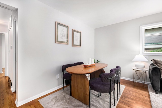 1700 Bristol Ave NW, Grand Rapids, MI 49504 - dining area with light wood-type flooring and baseboards