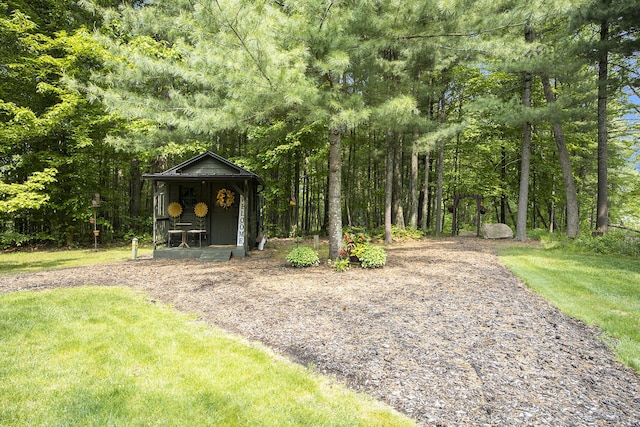 6838 E Michillinda Rd, Twin Lake, MI 49457 - view of grassy yard with a view of trees and an outdoor structure
