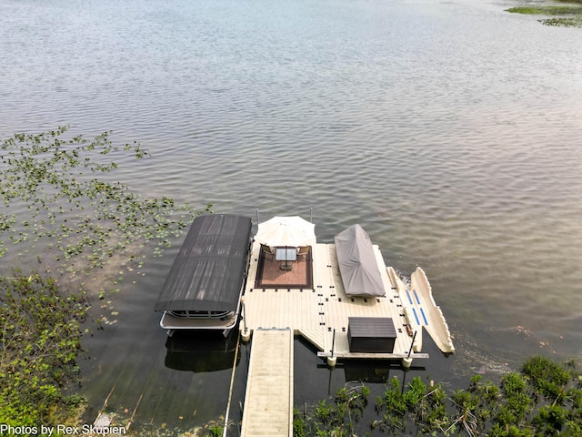 6838 E Michillinda Rd, Twin Lake, MI 49457 - dock area featuring a water view and boat lift
