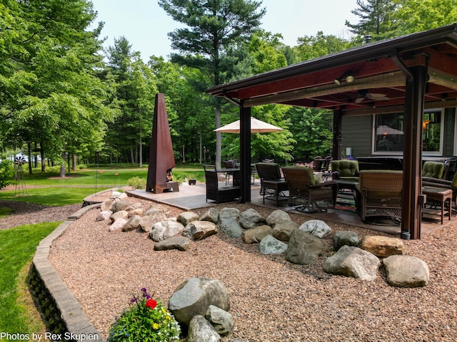 6838 E Michillinda Rd, Twin Lake, MI 49457 - view of grassy yard with ceiling fan and a patio area
