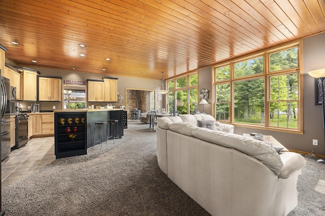 6838 E Michillinda Rd, Twin Lake, MI 49457 - living room with wooden ceiling, light colored carpet, and recessed lighting