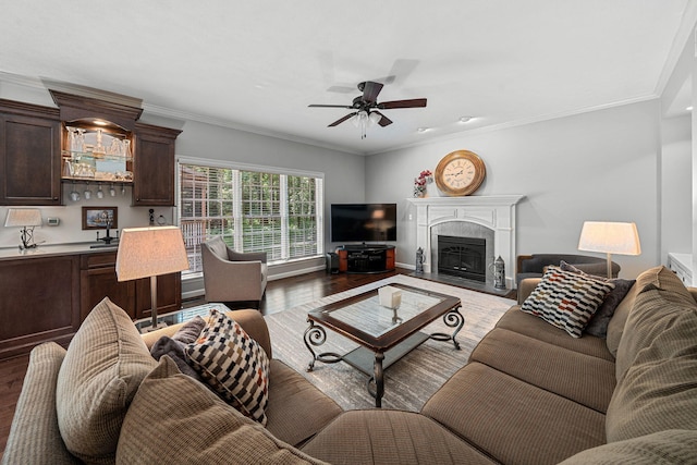 33081 Old Post Rd, Niles, MI 49120 - living room with wood finished floors, ceiling fan, ornamental molding, a fireplace with flush hearth, and baseboards