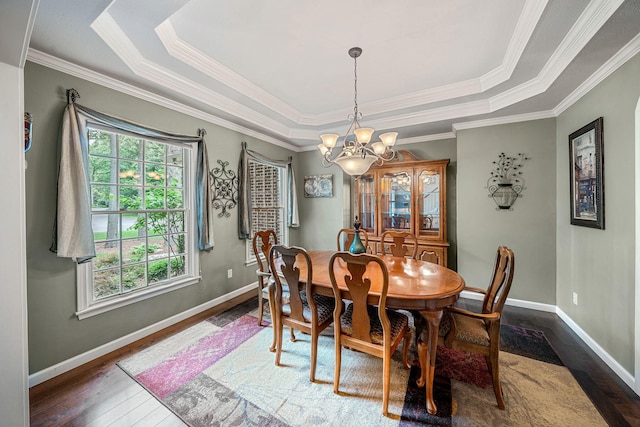 33081 Old Post Rd, Niles, MI 49120 - dining room featuring a chandelier, dark wood-style floors, a tray ceiling, crown molding, and baseboards